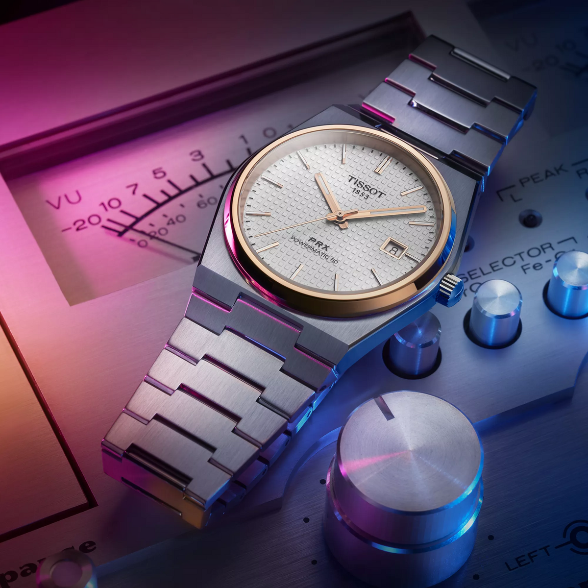 Tissot PRX 40mm watch on a colored background