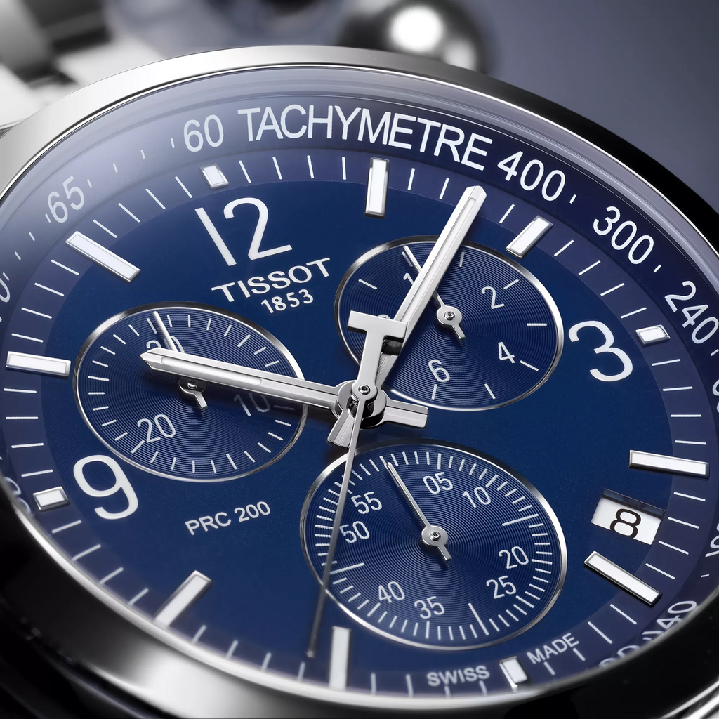 Tissot PRC 200 43mm watch on a colored background