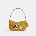 Coach Disney X Coach Swinger Bag In Regenerative Leather With Mickey Mouse And Friends - Silver/Flax Multi